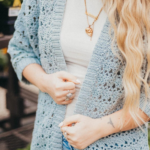 Stay light and breezy with the Suvi Summer Crochet Cardigan, made with soft, breathable Lion Brand Cottino yarn. Featuring openwork stitches, this cardigan is the perfect layering piece for cool summer nights—effortlessly stylish and comfortable for any warm-weather outfit.