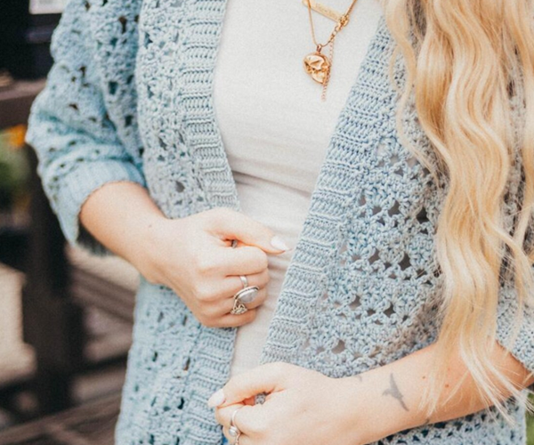 Stay light and breezy with the Suvi Summer Crochet Cardigan, made with soft, breathable Lion Brand Cottino yarn. Featuring openwork stitches, this cardigan is the perfect layering piece for cool summer nights—effortlessly stylish and comfortable for any warm-weather outfit.