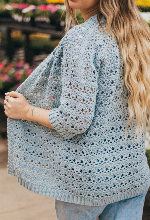 Stay light and breezy with the Suvi Summer Crochet Cardigan, made with soft, breathable Lion Brand Cottino yarn. Featuring openwork stitches, this cardigan is the perfect layering piece for cool summer nights—effortlessly stylish and comfortable for any warm-weather outfit.